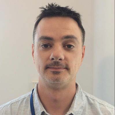 Headshot of Greg Craig. 