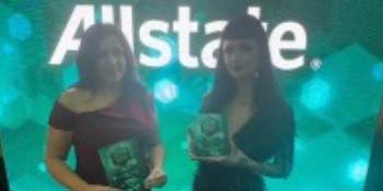 Lucinda Smith and Rachel Murphy McKeown holding awards given during the CCNI Awards. 