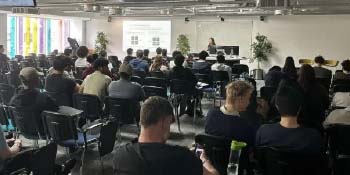Attendees of Hack Belfast sitting in a room. 