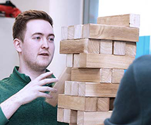 Allstate NI employees playing Jenga as a team building event. 
